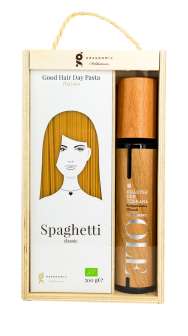 Wooden box with spagetti and olive oil
